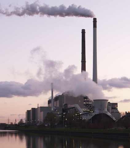 Power plant with smoke emitting from two different chimneys.