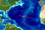 Map showing the Mid Atlantic Ridge with red arrows pointing in opposing directions towards the North American Plate and the African Plate.