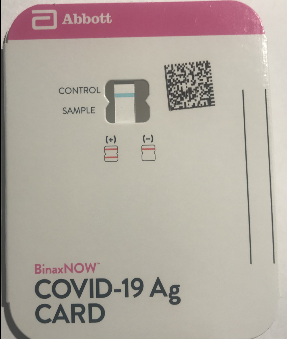 Abbott BinaxNOW COVID-19 Ag CARD with a white strip that has a blue line for "CONTROL" and blank space for "SAMPLE".